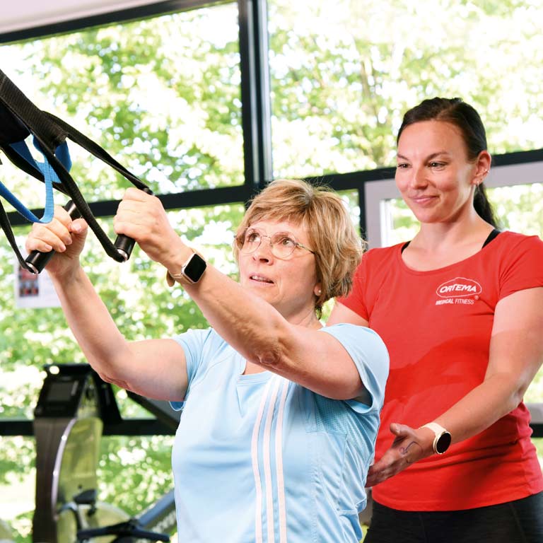 Sportübung mit Patientin
